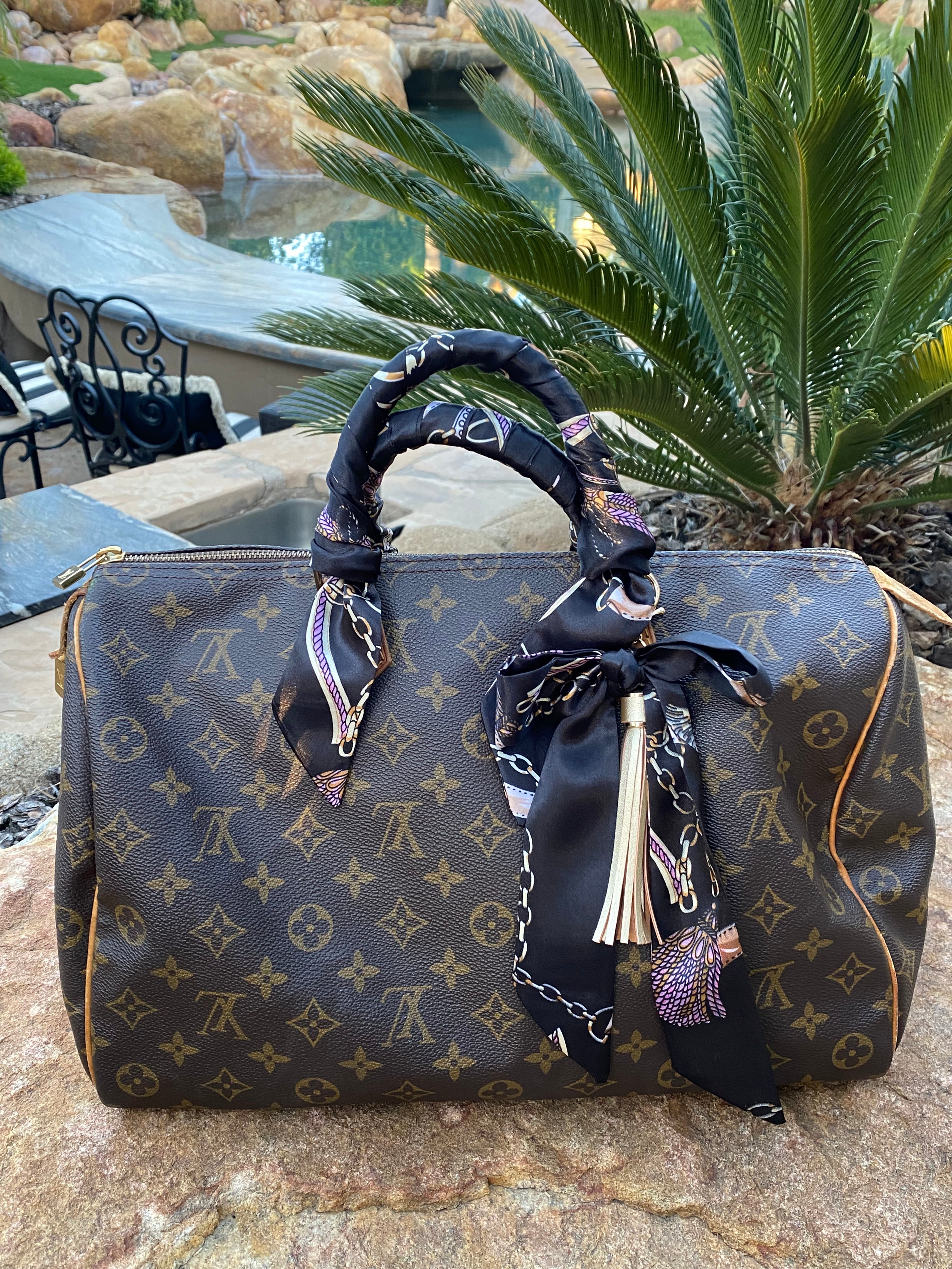 Monogram Speedy 35 and Artsy MM with twilly scarves on the handles